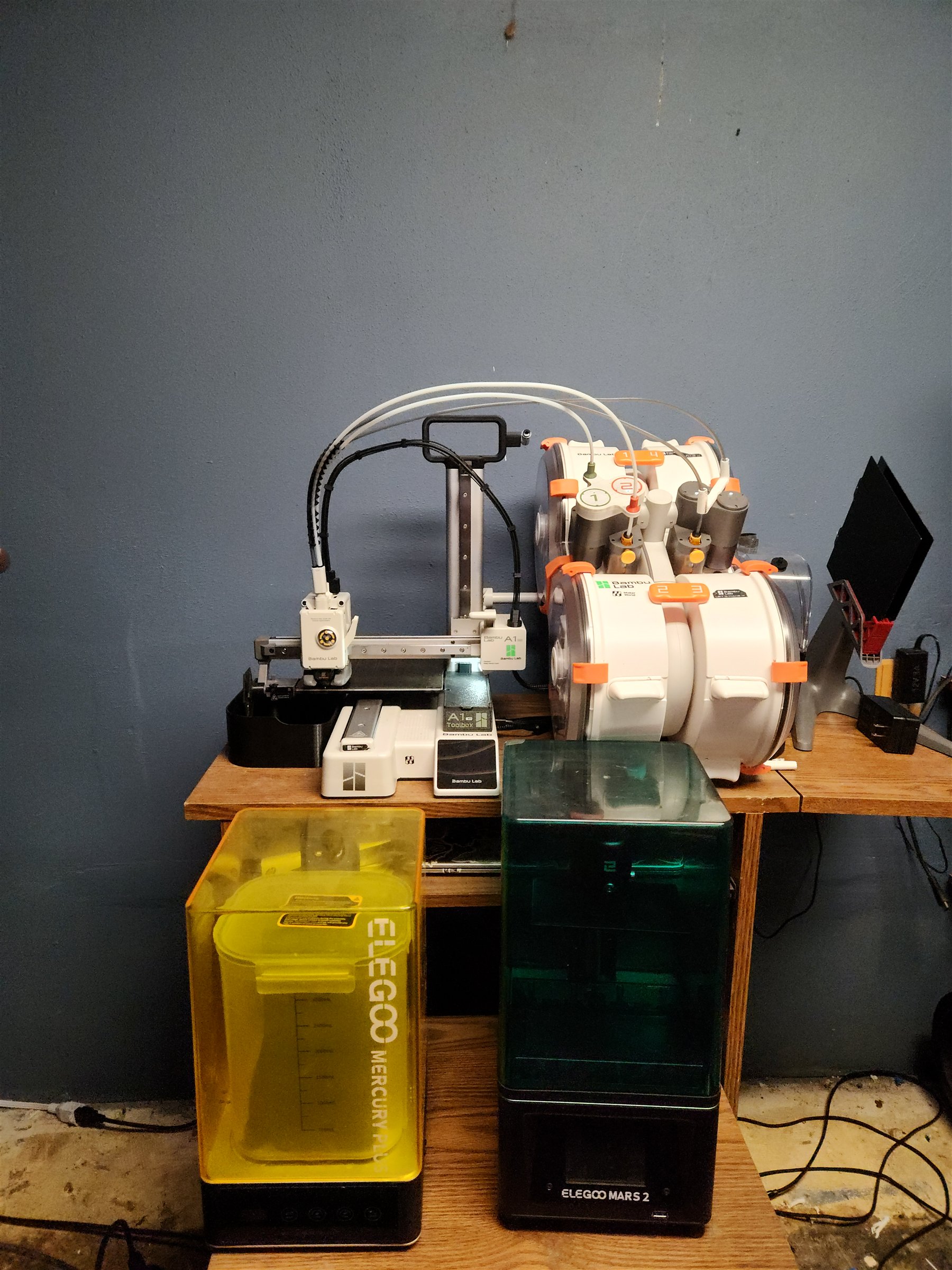 My Bambu Lab A1 mini and AMS Lite above an ELEGOO Mercury Plus wash-and-cure station and ELEGOO Mars 2 resin printer